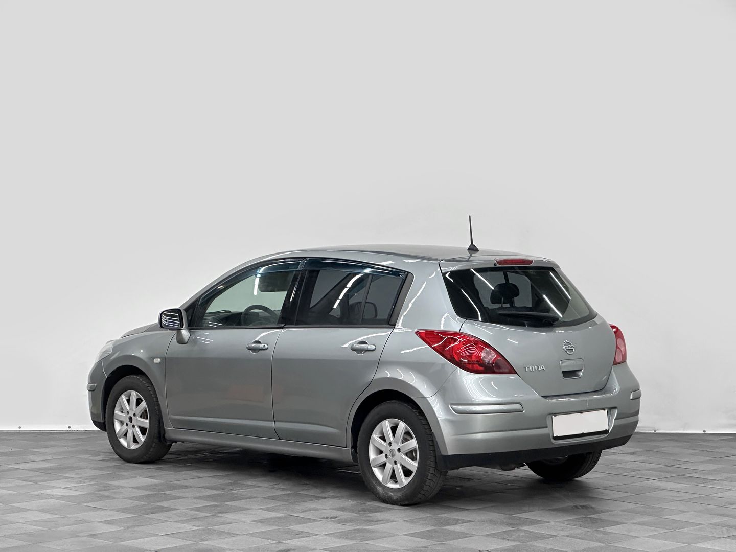 Nissan Tiida, I Рестайлинг 1.6 MT (110 л.с.)